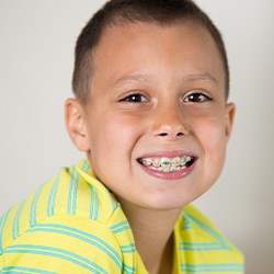 Smiling boy wearing traditional braces