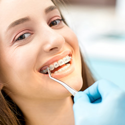 a patient with braces smiling during a dental appointment